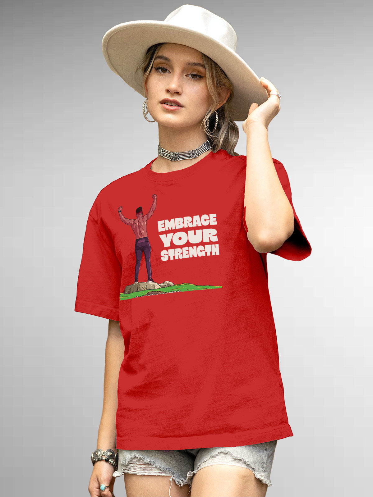 Model wearing Women's Red Round Neck T-shirt with 'Embrace Your Strength' design, offering effortless style and premium comfort