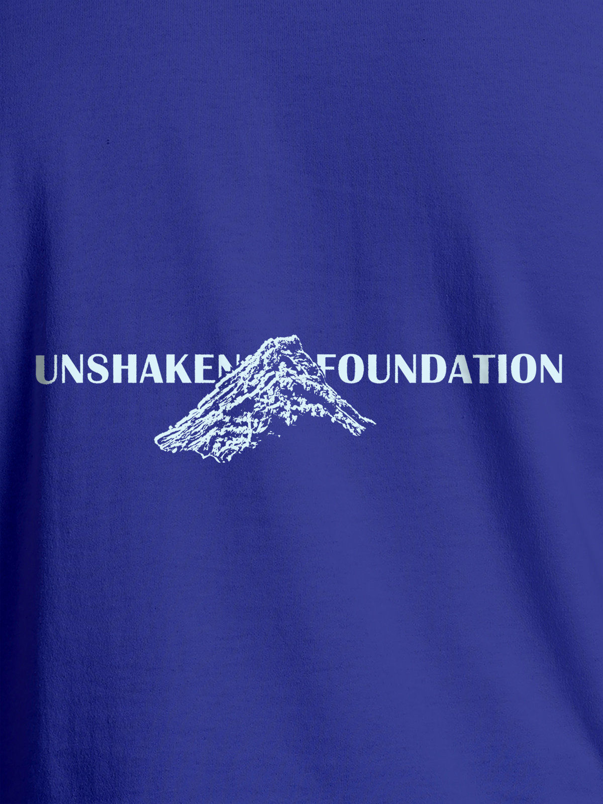 Close up of 'Unshaken Foundation' design on Men's Blue Round Neck T-shirt, highlighting intricate details and vibrant print.