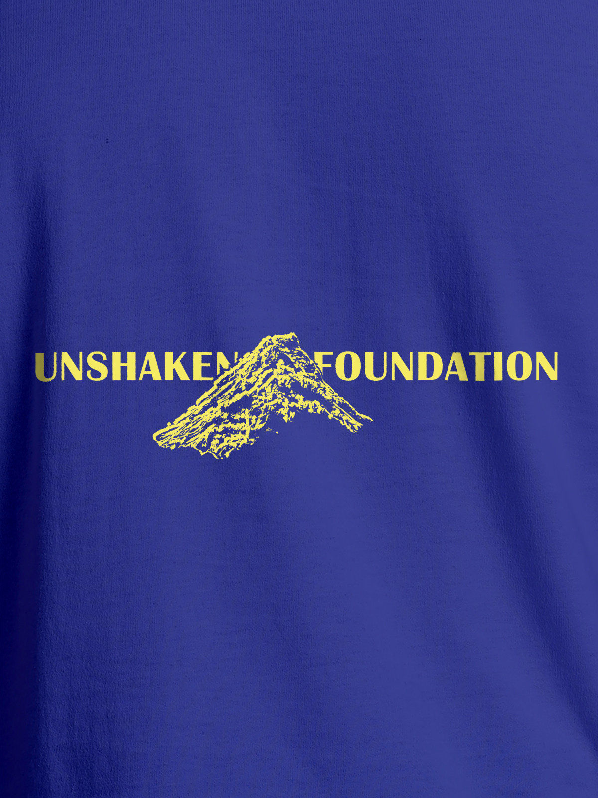 Close up of 'Unshaken Foundation' design on Men's Blue Round Neck T-shirt, highlighting intricate details and vibrant print.