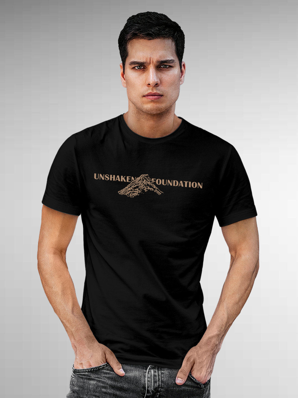 Model wearing Men's Black Round Neck T-shirt with 'Unshaken Foundation' design, offering effortless style and premium comfort