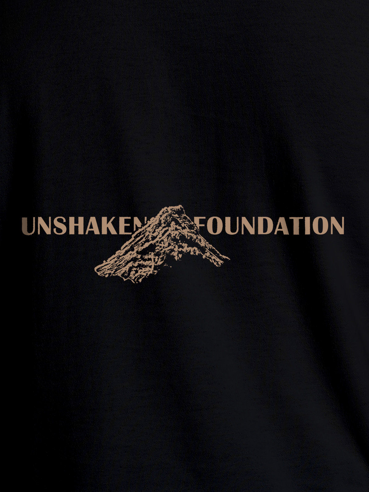 Close up of 'Unshaken Foundation' design on Men's Black Round Neck T-shirt, highlighting intricate details and vibrant print.