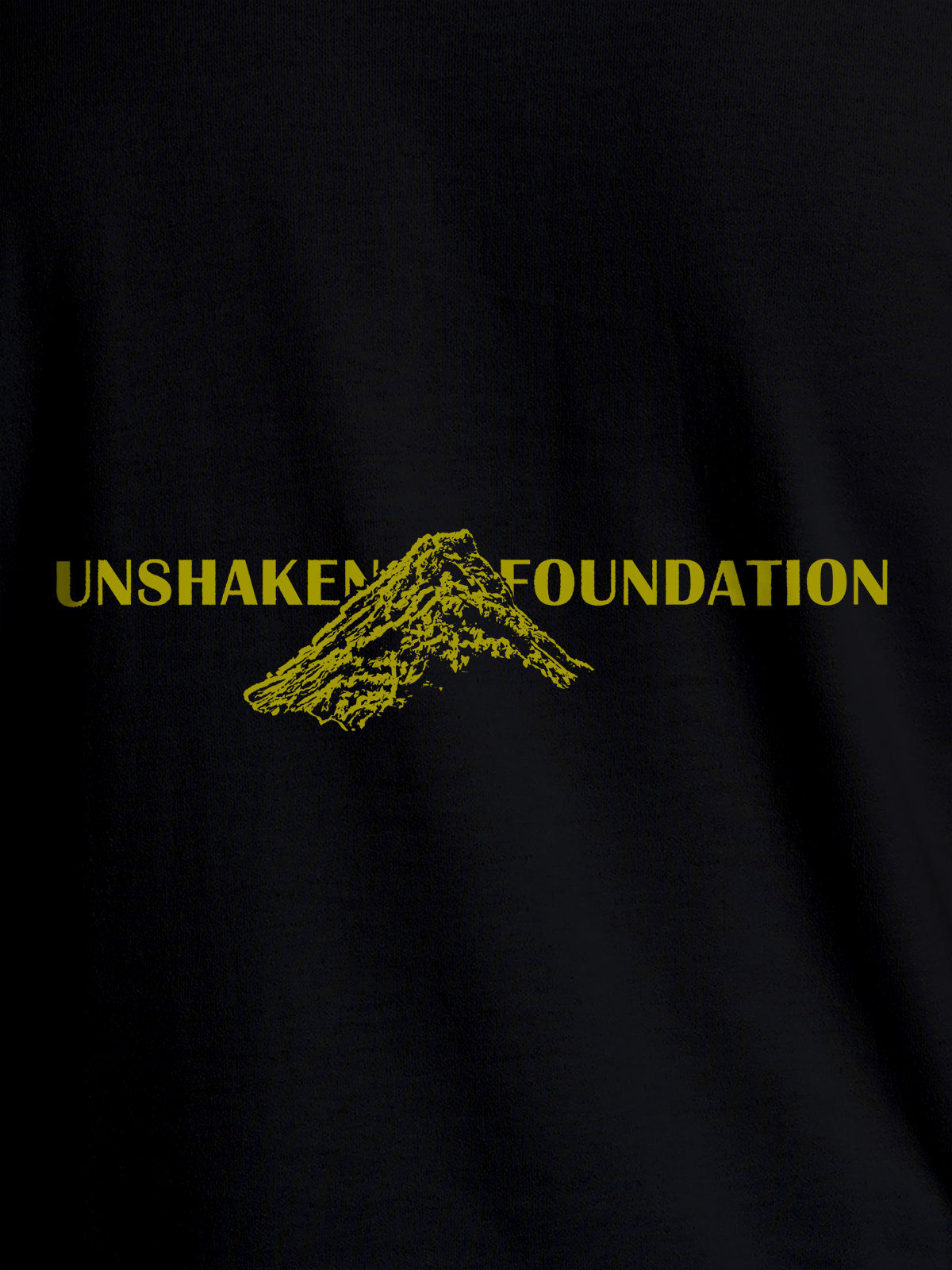 Close up of 'Unshaken Foundation' design on Men's Black Round Neck T-shirt, highlighting intricate details and vibrant print.