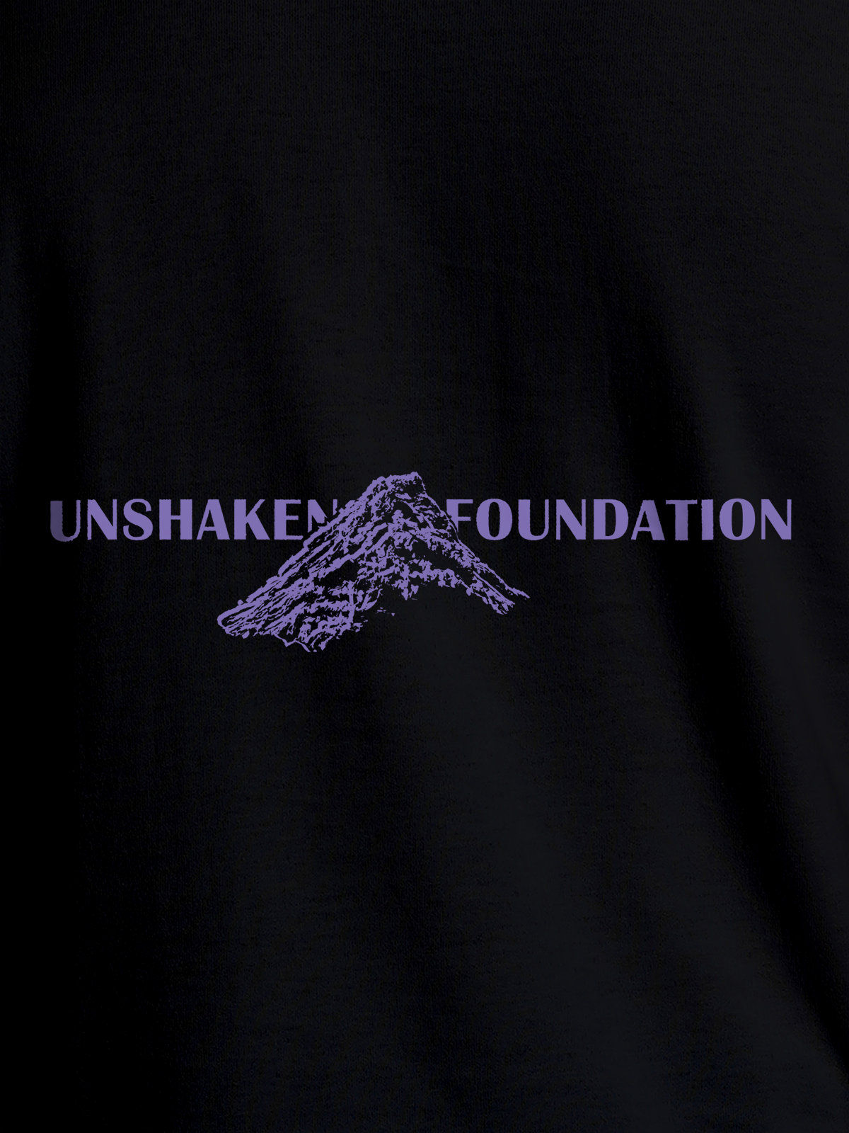 Close up of 'Unshaken Foundation' design on Men's Black Round Neck T-shirt, highlighting intricate details and vibrant print.