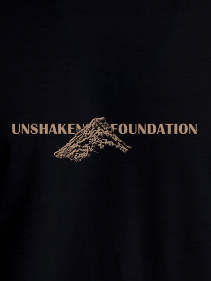 Close up of 'Unshaken Foundation' design on Women's Black Round Neck T-shirt, highlighting intricate details and vibrant print.