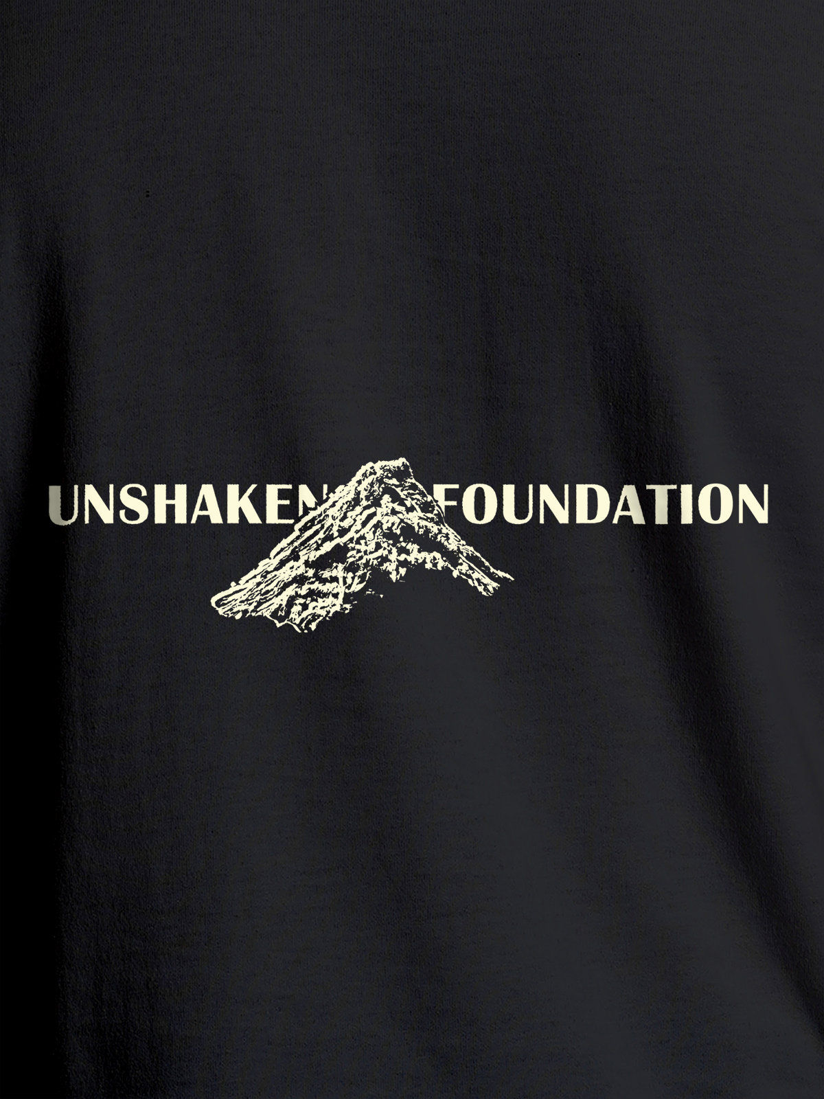 Close up of 'Unshaken Foundation' design on Men's Dark Grey Round Neck T-shirt, highlighting intricate details and vibrant print.