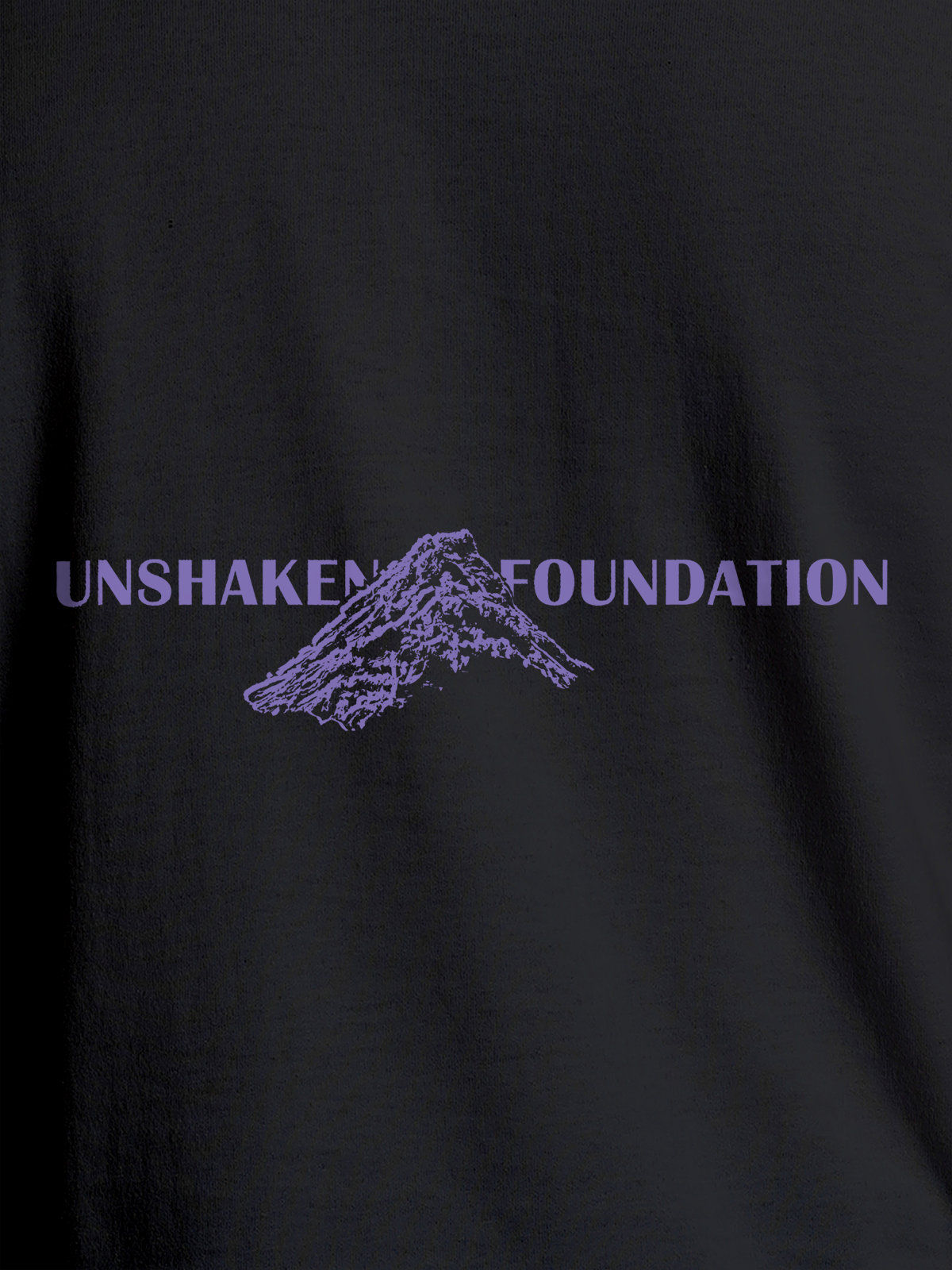 Close up of 'Unshaken Foundation' design on Men's Dark Grey Round Neck T-shirt, highlighting intricate details and vibrant print.
