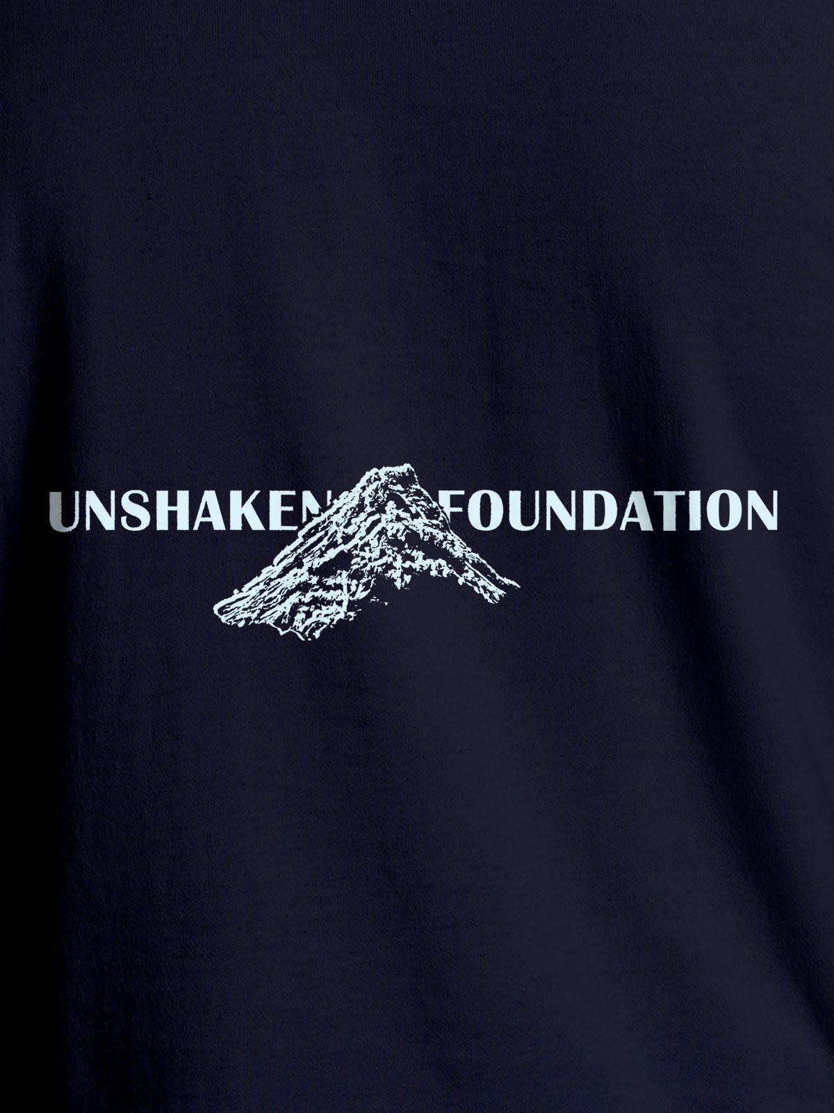 Close up of 'Unshaken Foundation' design on Men's Navy Blue Round Neck T-shirt, highlighting intricate details and vibrant print.