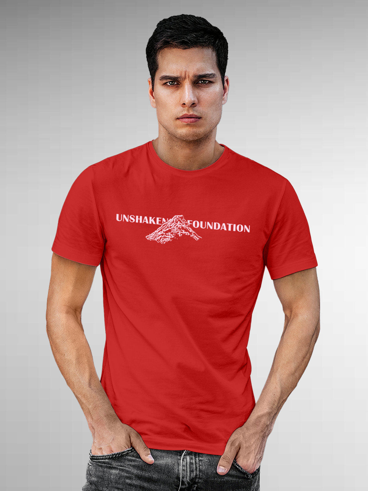 Model wearing Men's Red Round Neck T-shirt with 'Unshaken Foundation' design, offering effortless style and premium comfort