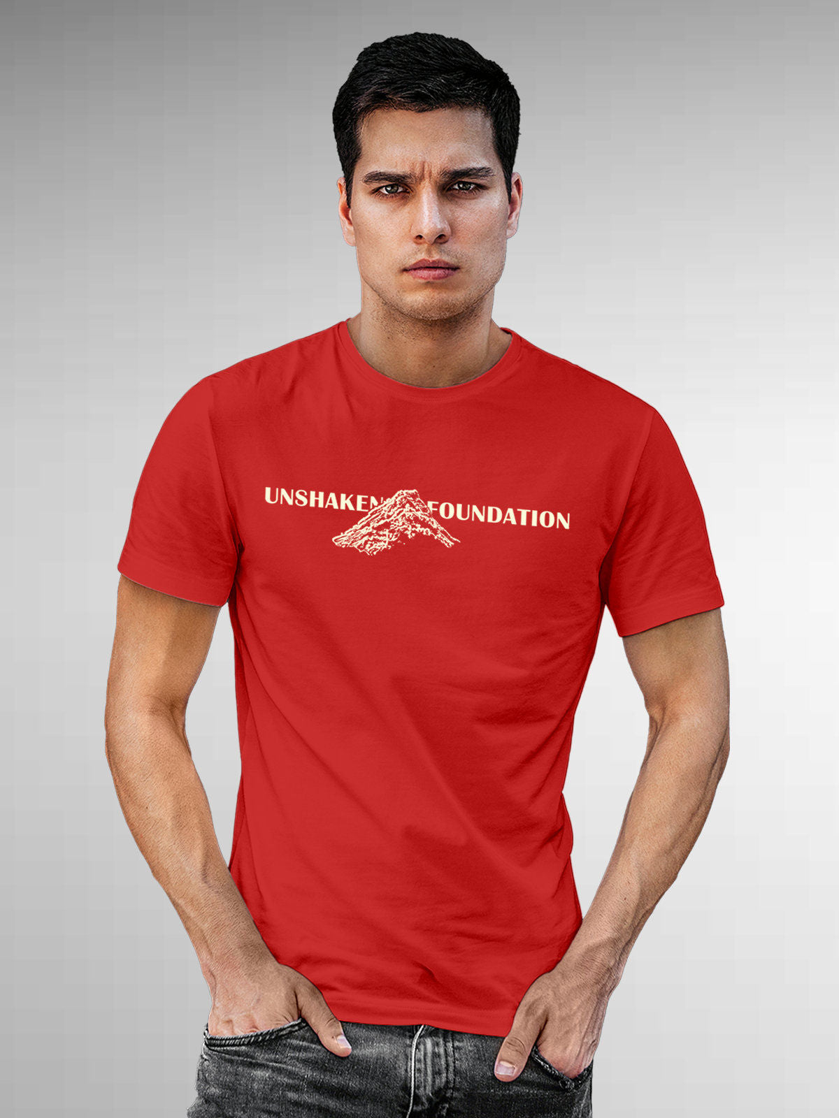 Model wearing Men's Red Round Neck T-shirt with 'Unshaken Foundation' design, offering effortless style and premium comfort