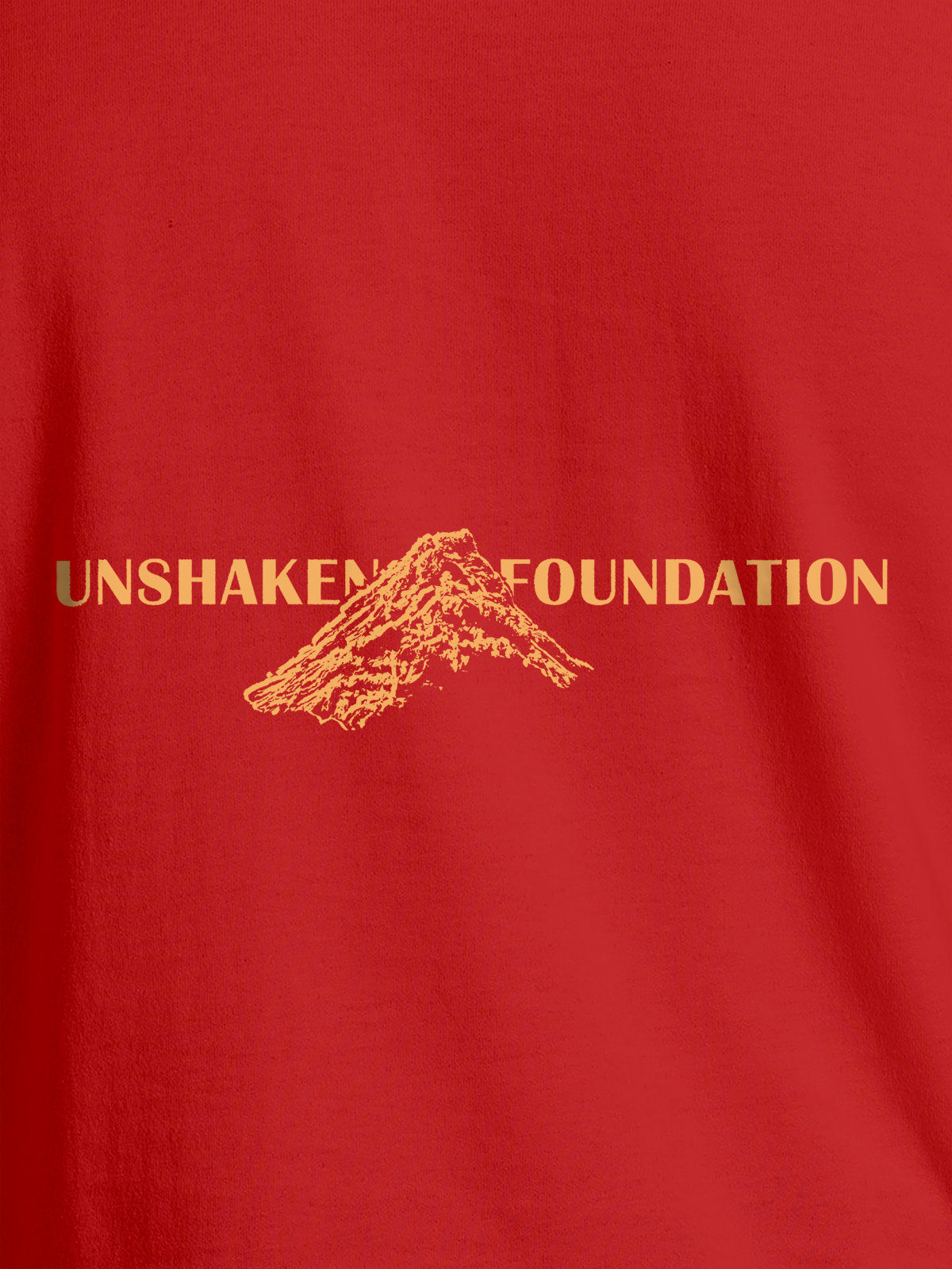 Close up of 'Unshaken Foundation' design on Men's Red Round Neck T-shirt, highlighting intricate details and vibrant print.