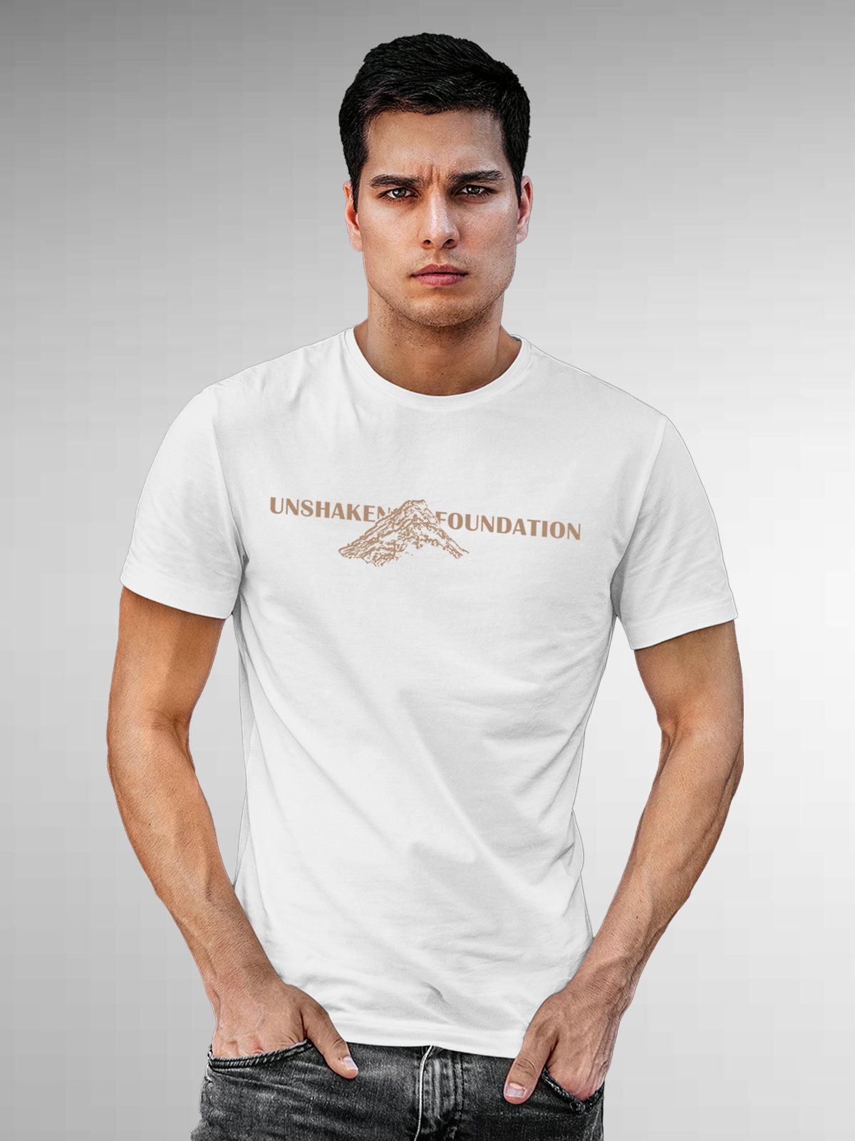 Model wearing Men's White Round Neck T-shirt with 'Unshaken Foundation' design, offering effortless style and premium comfort