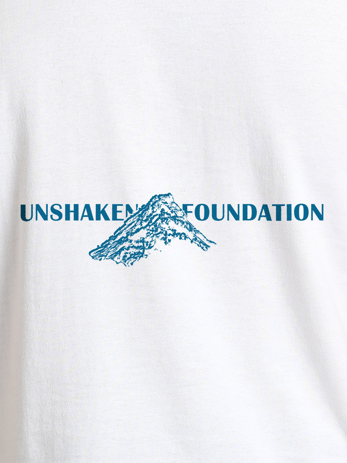 Close up of 'Unshaken Foundation' design on Men's White Round Neck T-shirt, highlighting intricate details and vibrant print.
