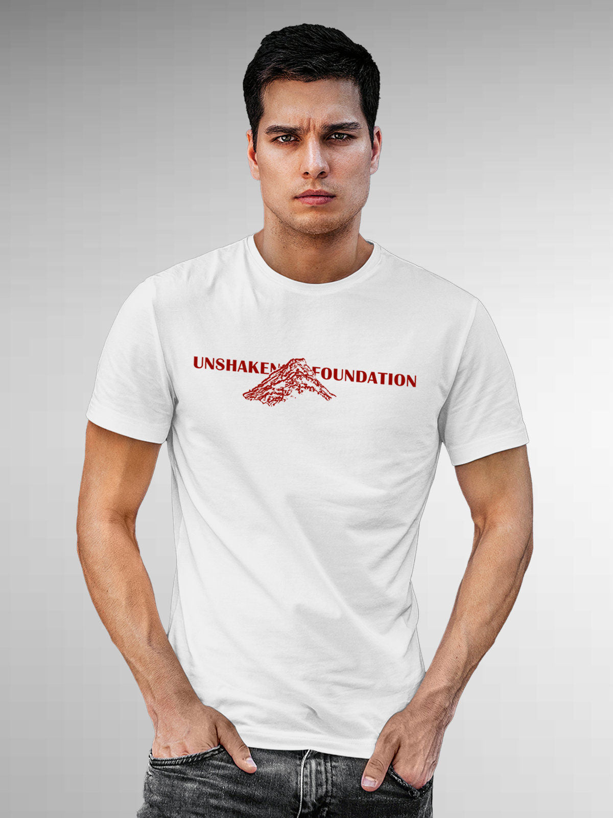 Model wearing Men's White Round Neck T-shirt with 'Unshaken Foundation' design, offering effortless style and premium comfort