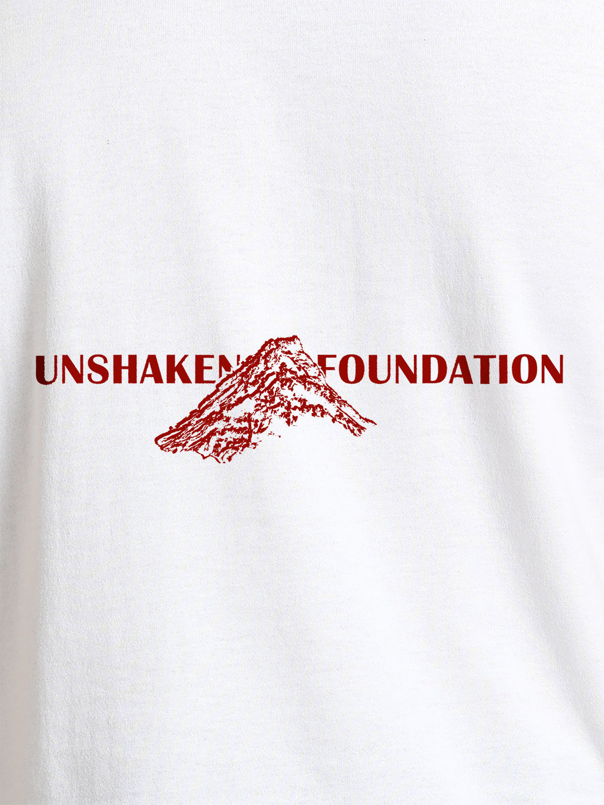 Close up of 'Unshaken Foundation' design on Men's White Round Neck T-shirt, highlighting intricate details and vibrant print.