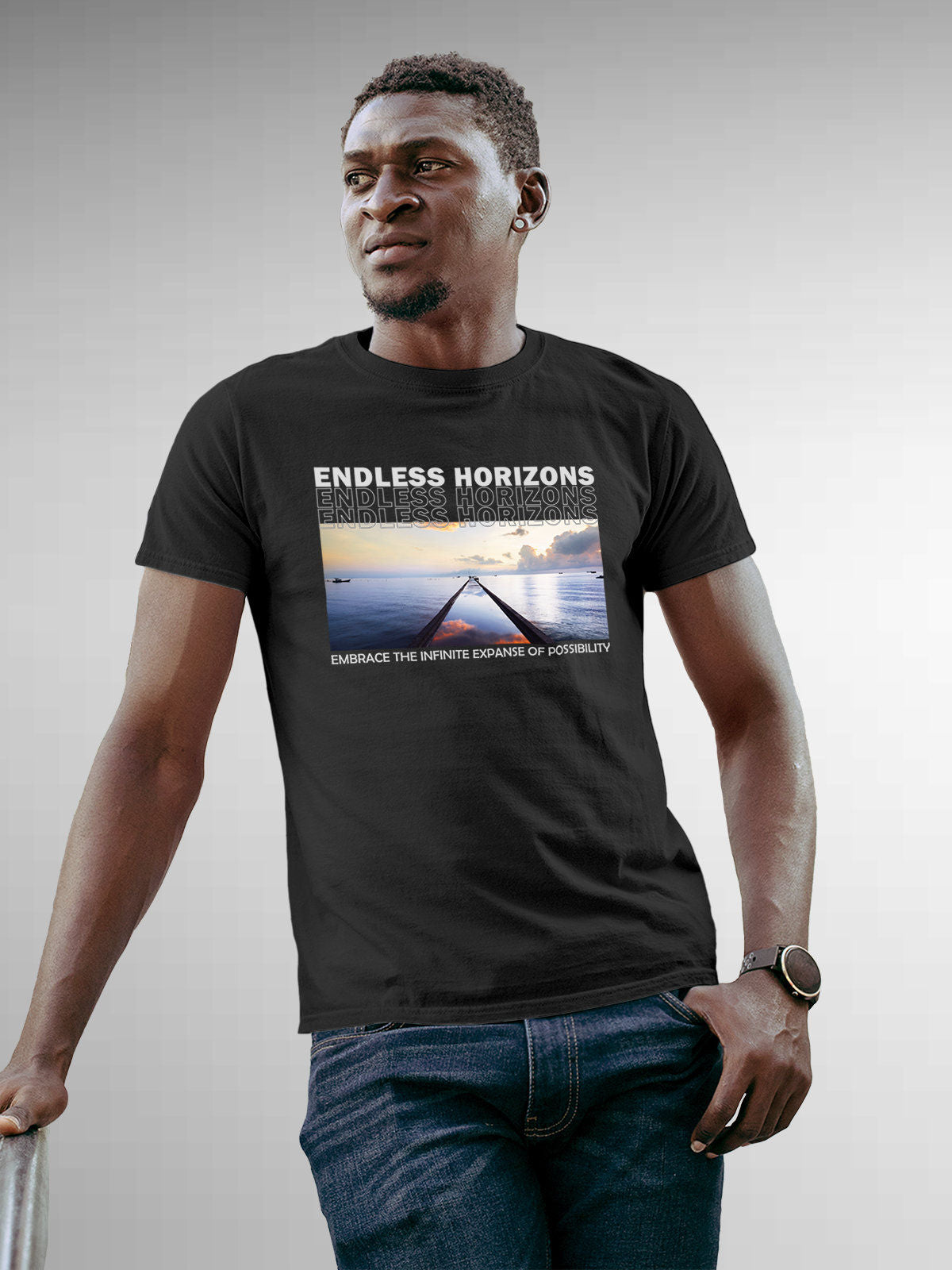 Model wearing Men's Dark Grey Round Neck T-shirt with 'Endless Horizons' design, offering effortless style and premium comfort