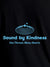 Close up of 'Bound By Kindness' design on Men's Black Round Neck T-shirt, highlighting intricate details and vibrant print.