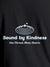 Close up of 'Bound By Kindness' design on Men's Dark Grey Round Neck T-shirt, highlighting intricate details and vibrant print.