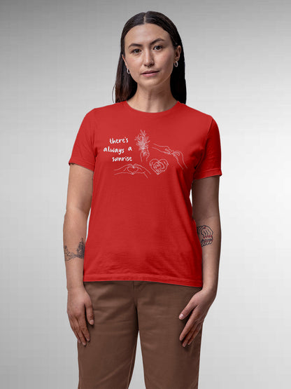Model wearing Women's Red Round Neck T-shirt with 'There's Always a Sunrise' design, offering effortless style and premium comfort