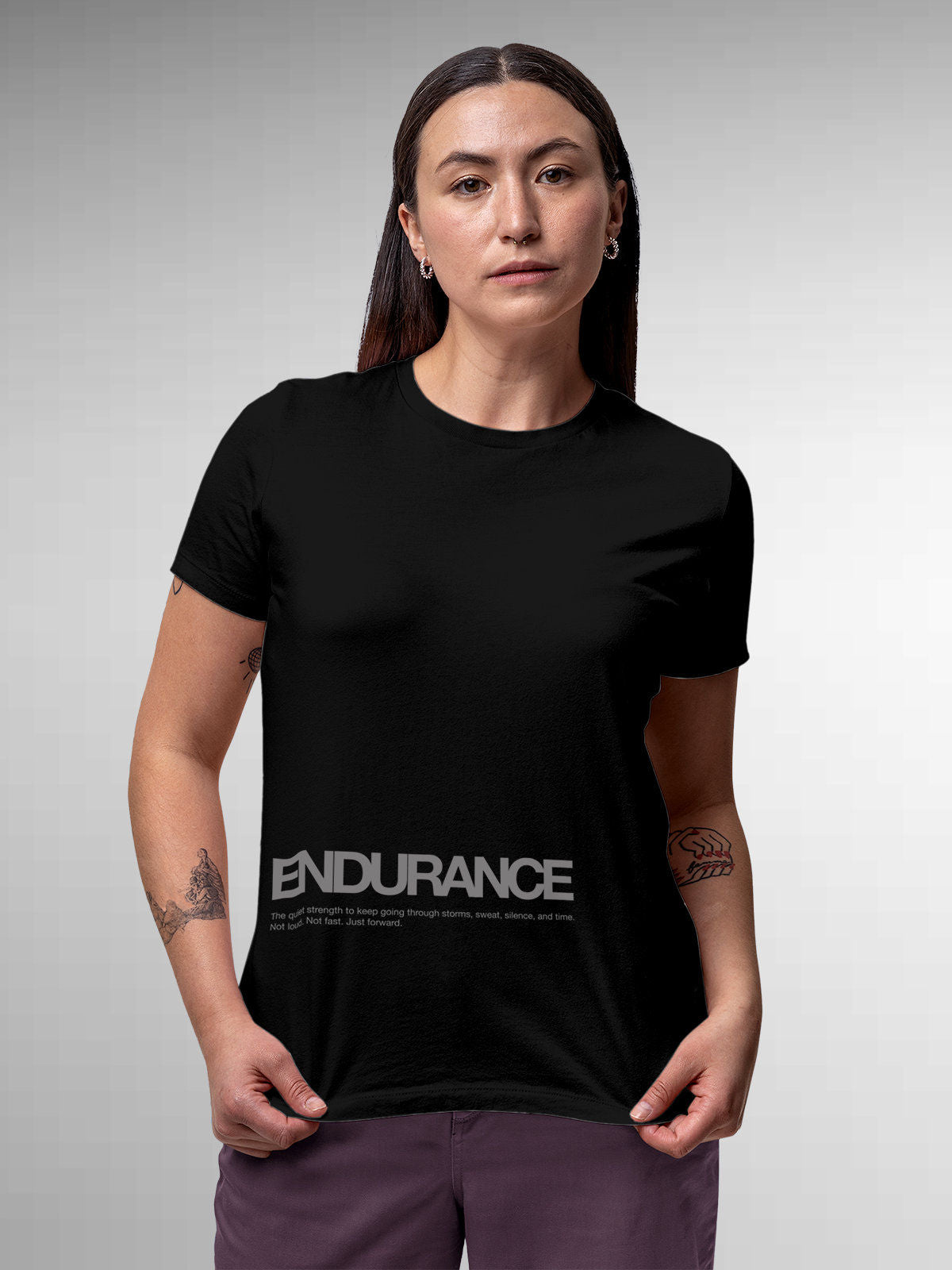 Model wearing Women's Black Round Neck T-shirt with 'Endurance' design, offering effortless style and premium comfort