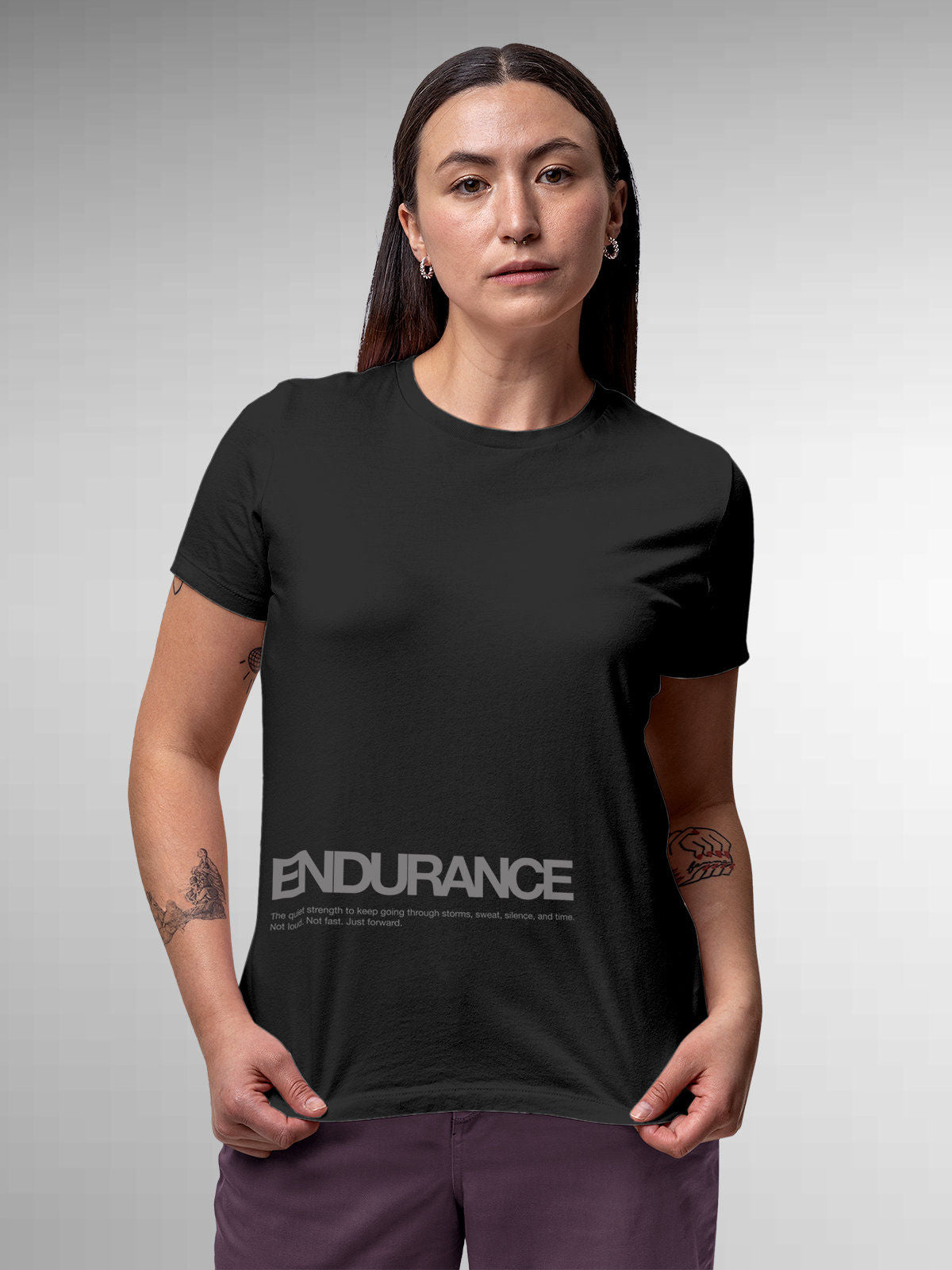 Model wearing Women's Dark Grey Round Neck T-shirt with 'Endurance' design, offering effortless style and premium comfort