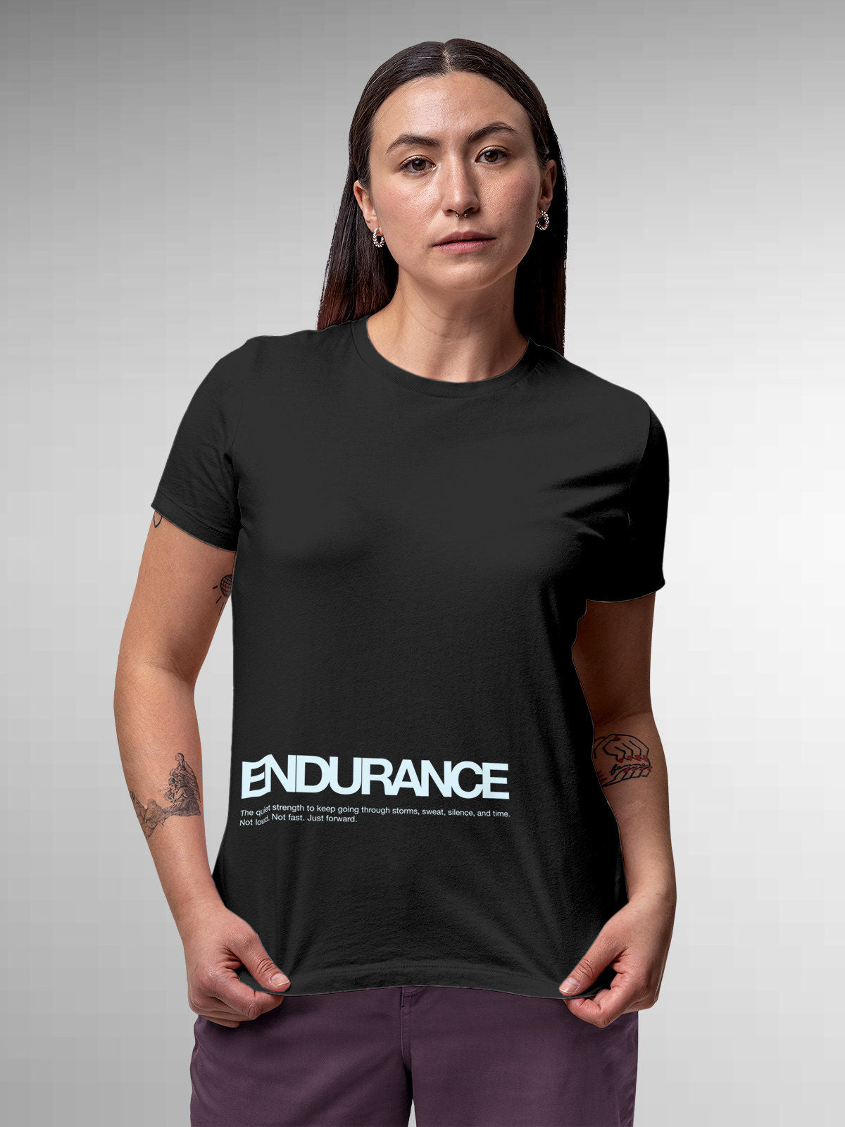 Model wearing Women's Dark Grey Round Neck T-shirt with 'Endurance' design, offering effortless style and premium comfort