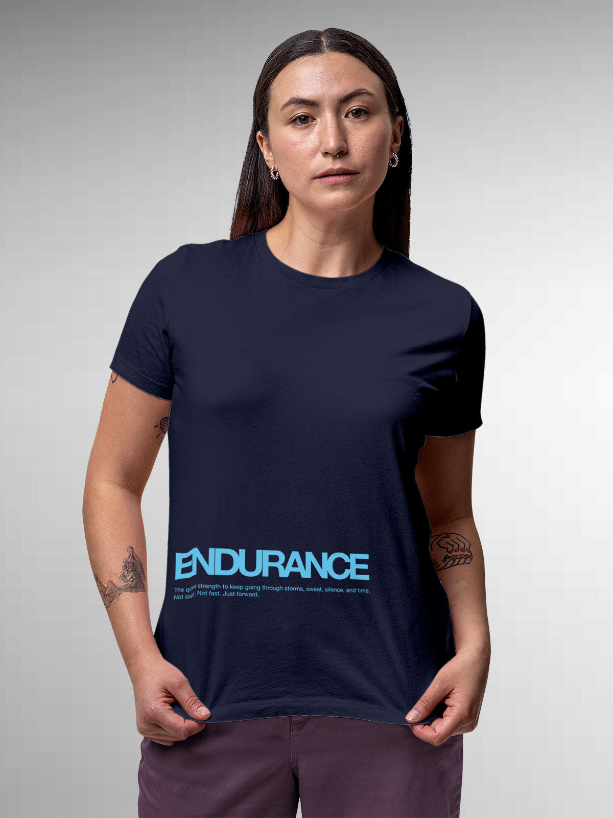 Model wearing Women's Navy Blue Round Neck T-shirt with 'Endurance' design, offering effortless style and premium comfort