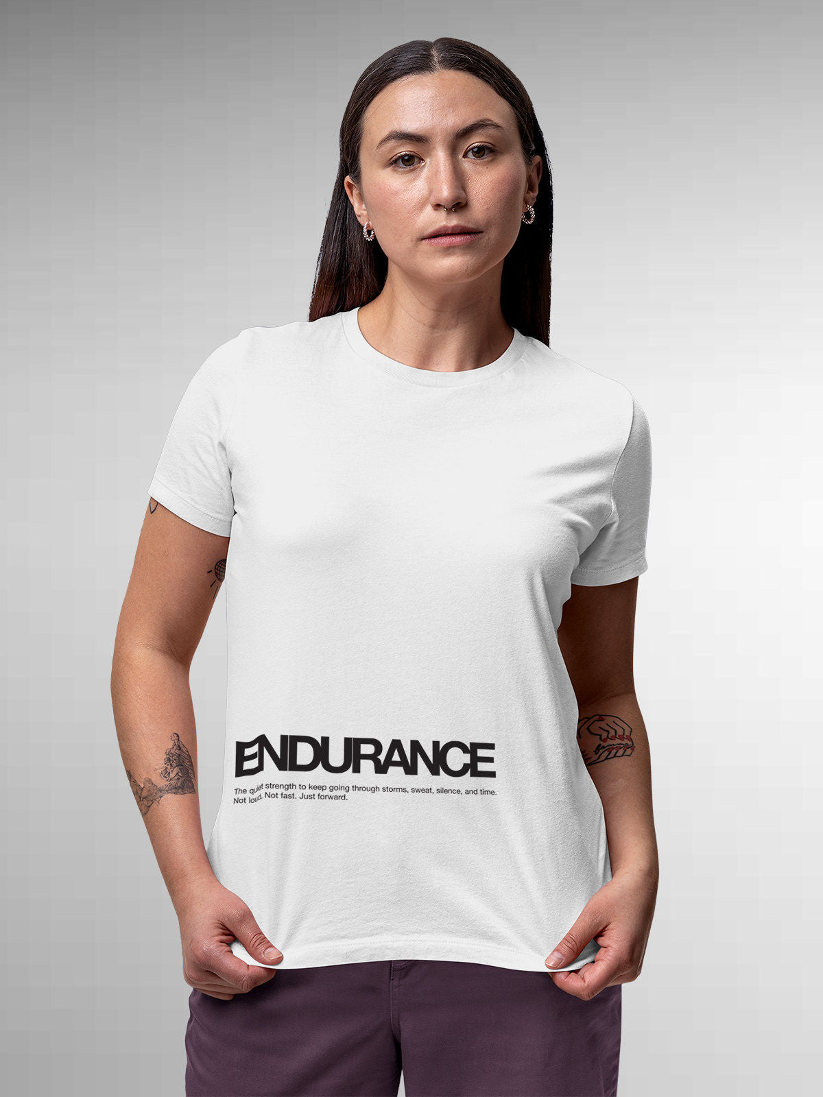 Model wearing Women's White Round Neck T-shirt with 'Endurance' design, offering effortless style and premium comfort