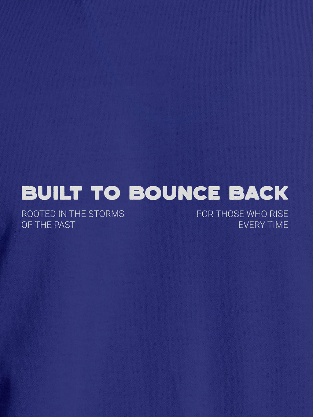 Close up of 'Built To Bounce Back' design on Men's Blue Round Neck T-shirt, highlighting intricate details and vibrant print.