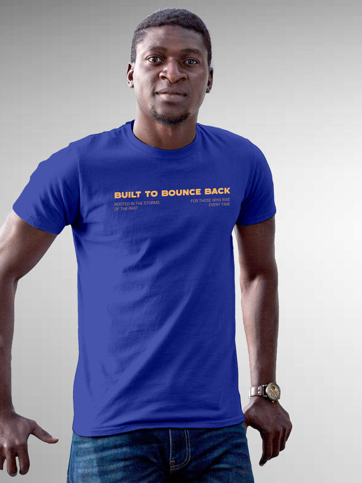 Model wearing Men's Blue Round Neck T-shirt with 'Built To Bounce Back' design, offering effortless style and premium comfort
