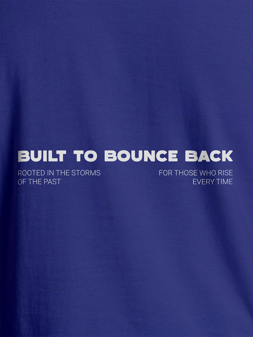 Close up of 'Built To Bounce Back' design on Women's Blue Round Neck T-shirt, highlighting intricate details and vibrant print.