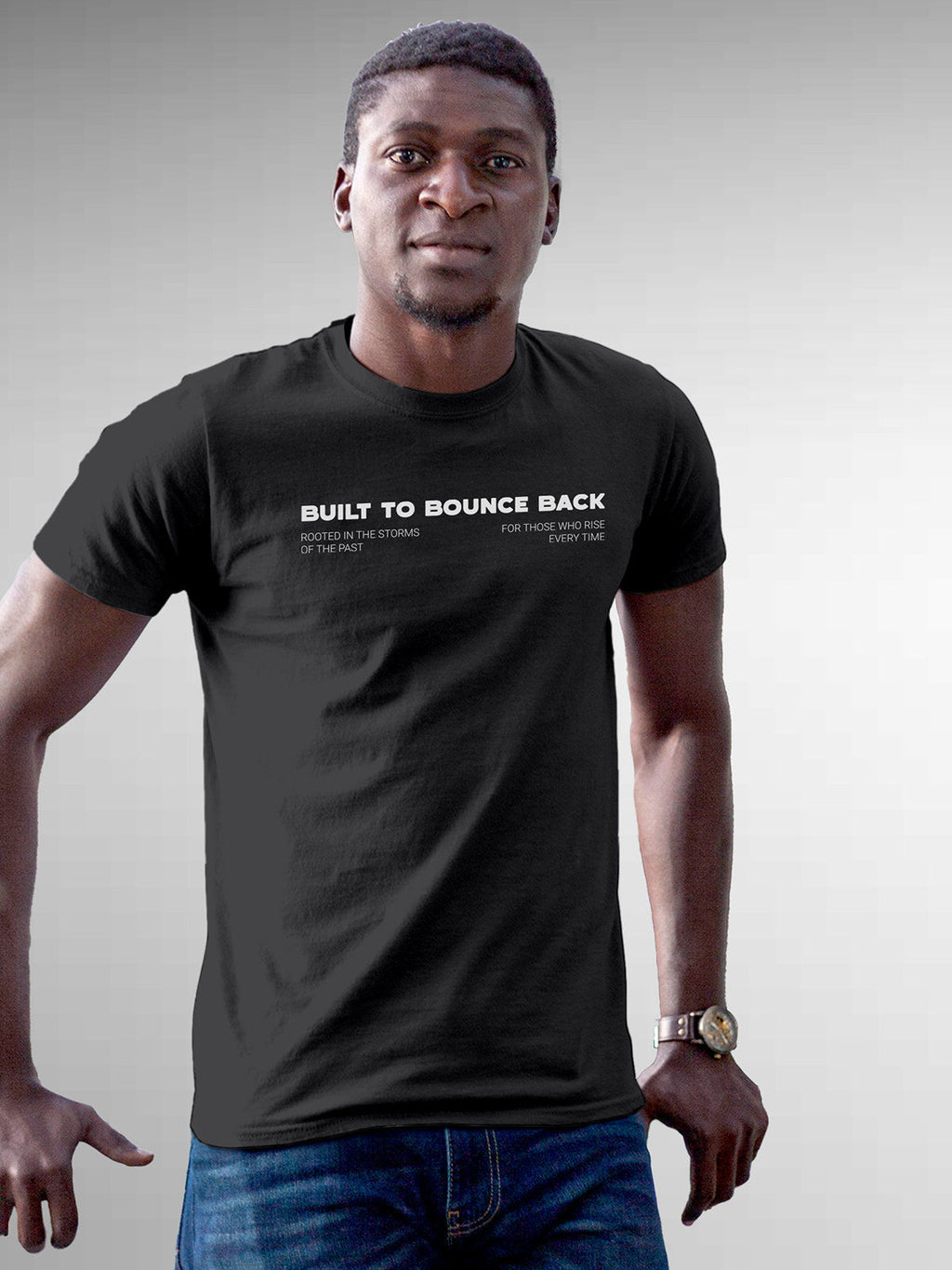 Model wearing Men's Dark Grey Round Neck T-shirt with 'Built To Bounce Back' design, offering effortless style and premium comfort