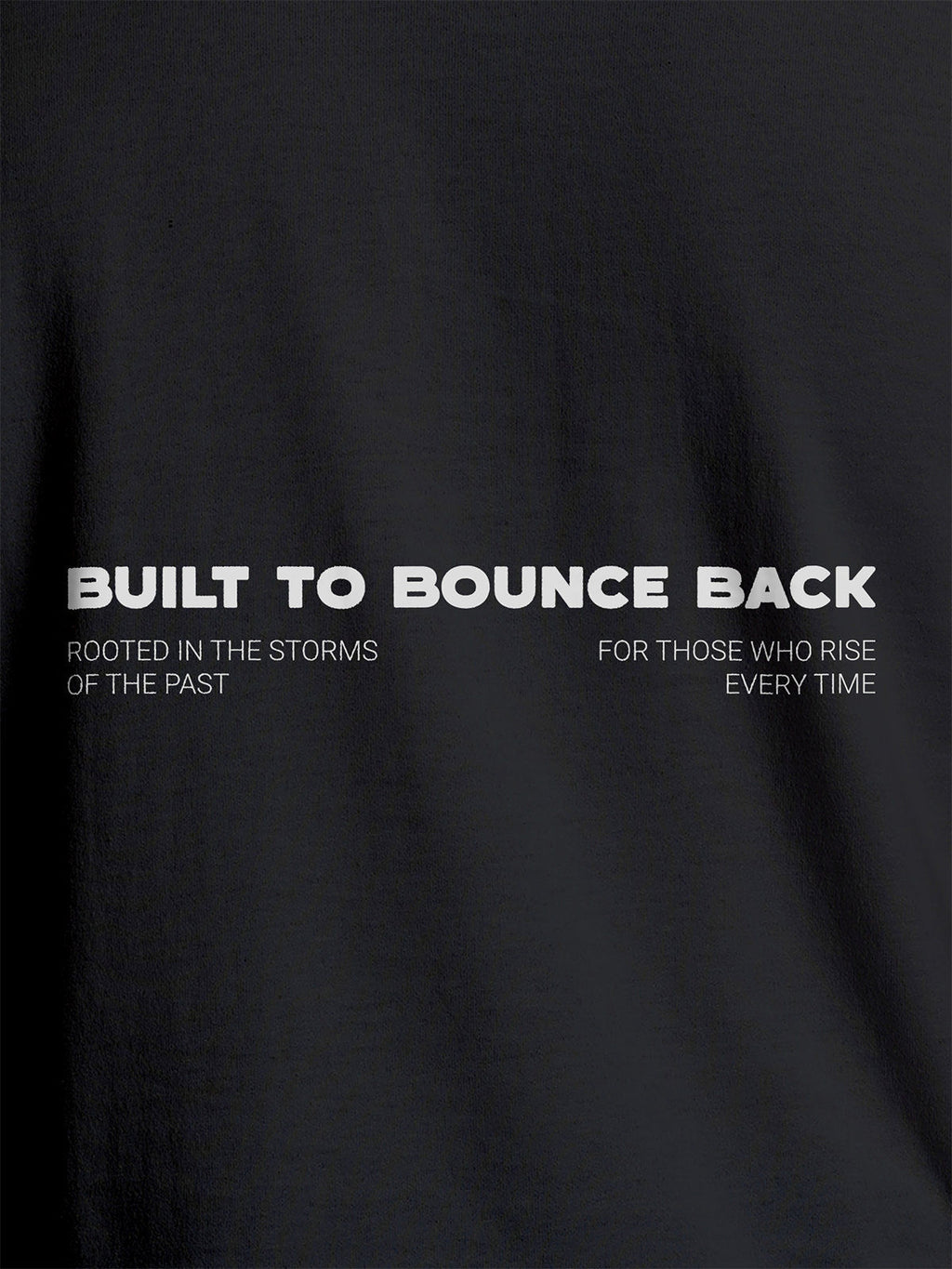 Close up of 'Built To Bounce Back' design on Women's Dark Grey Round Neck T-shirt, highlighting intricate details and vibrant print.