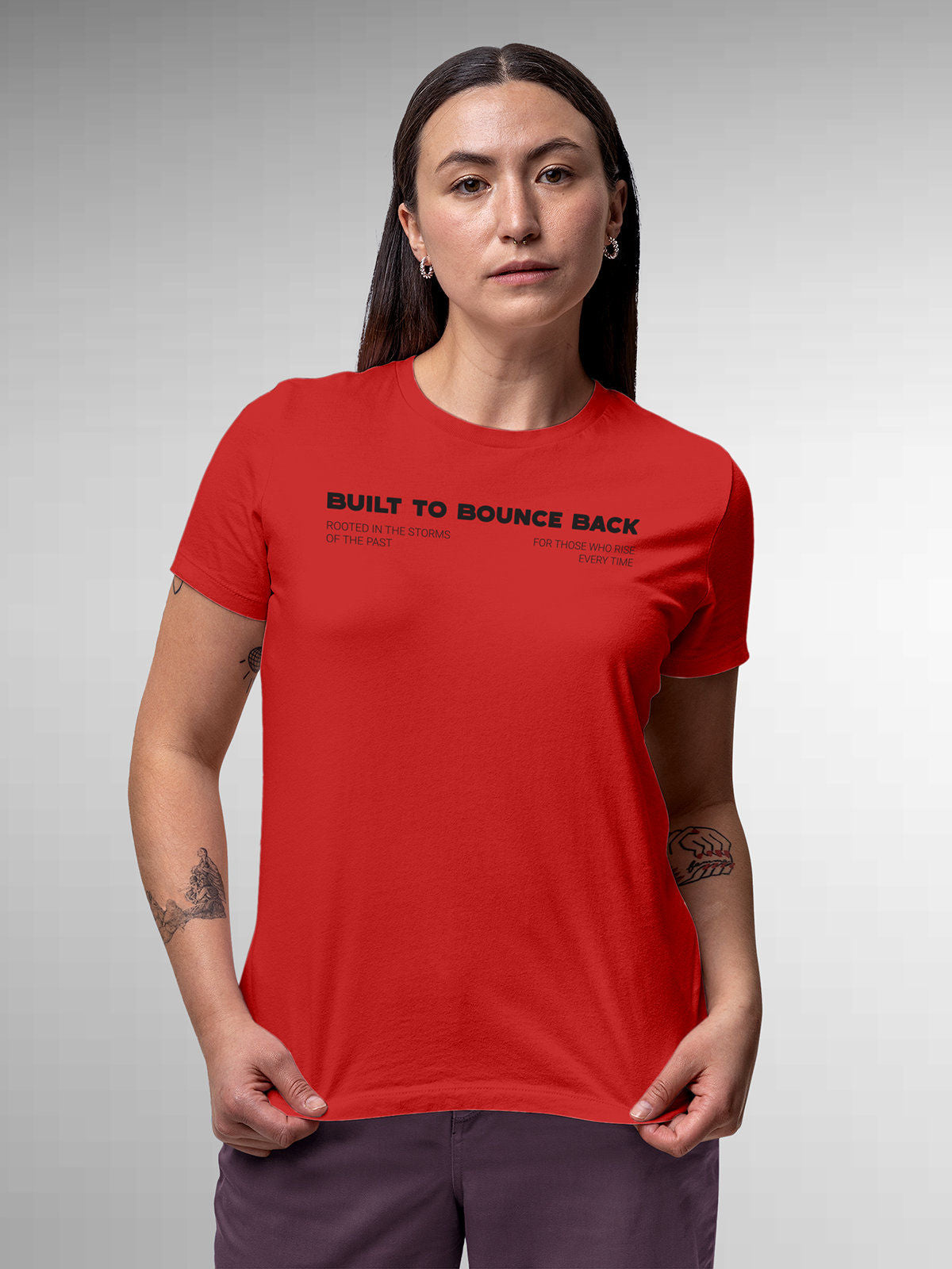 Model wearing Women's Red Round Neck T-shirt with 'Built To Bounce Back' design, offering effortless style and premium comfort