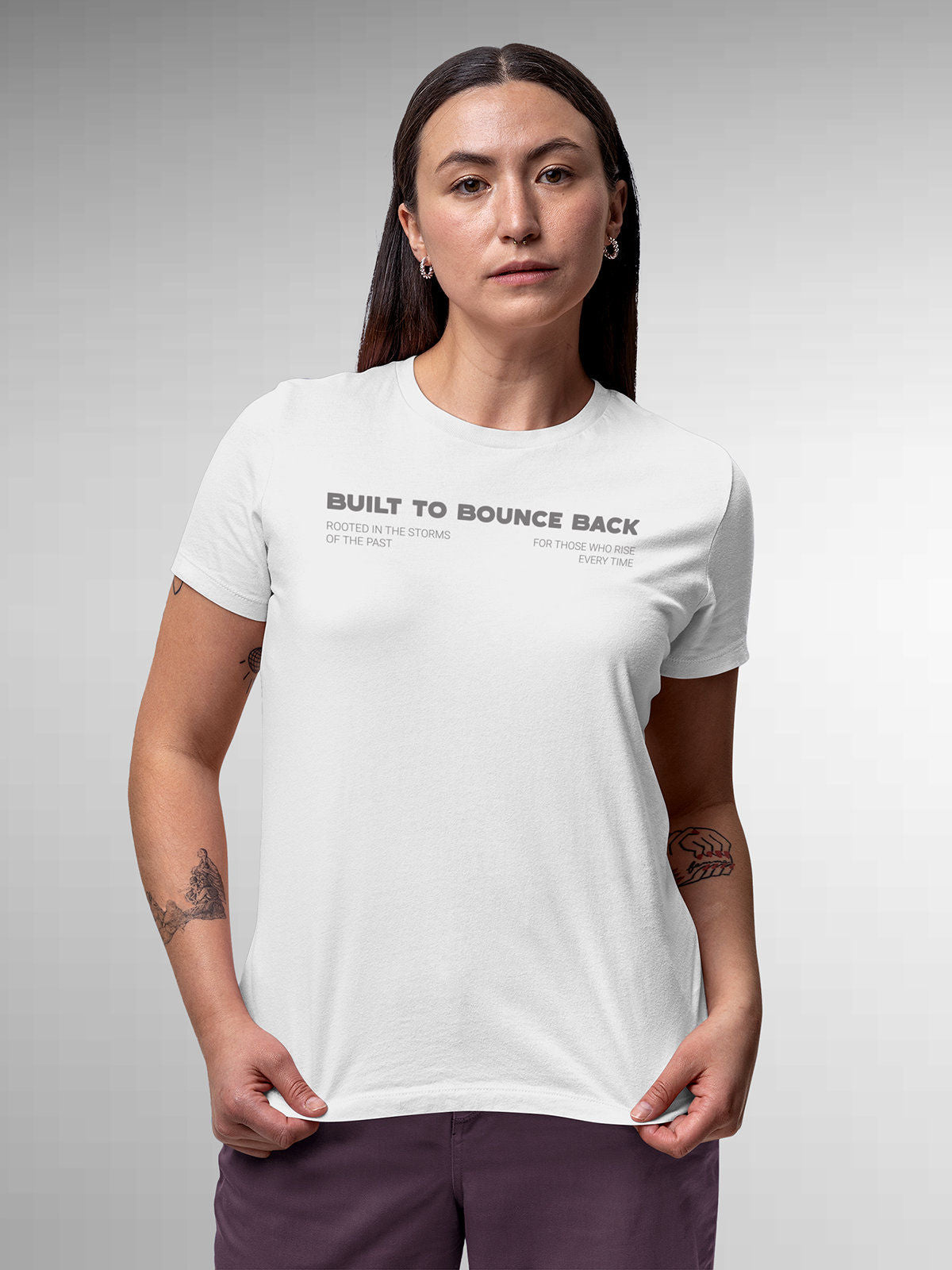 Model wearing Women's White Round Neck T-shirt with 'Built To Bounce Back' design, offering effortless style and premium comfort