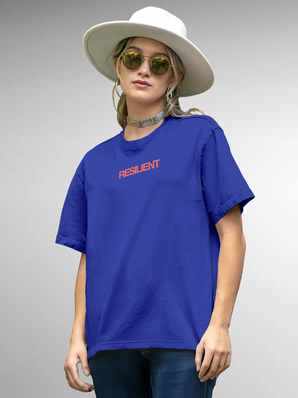 Model wearing Women's Blue Round Neck T-shirt with 'Resilient' design, offering effortless style and premium comfort