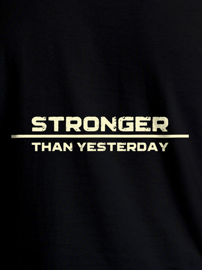 Close up of 'Stronger Than Yesterday' design on Men's Black Round Neck T-shirt, highlighting intricate details and vibrant print.