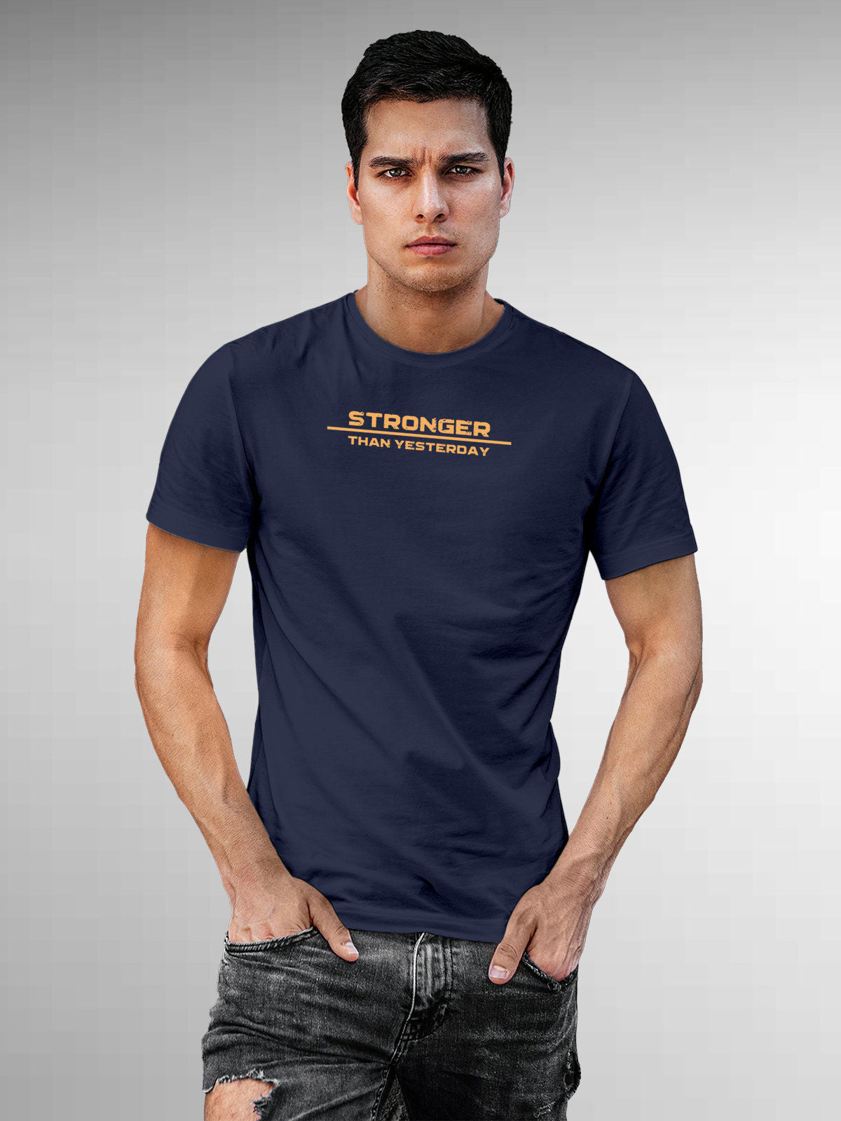 Model wearing Men's Navy Blue Round Neck T-shirt with 'Stronger Than Yesterday' design, offering effortless style and premium comfort