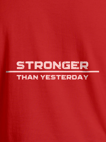 Close up of 'Stronger Than Yesterday' design on Men's Red Round Neck T-shirt, highlighting intricate details and vibrant print.