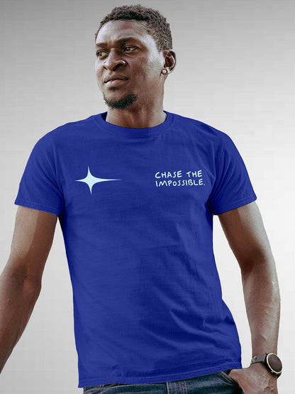 Model wearing Men's Blue Round Neck T-shirt with 'Chase The Impossible' design, offering effortless style and premium comfort