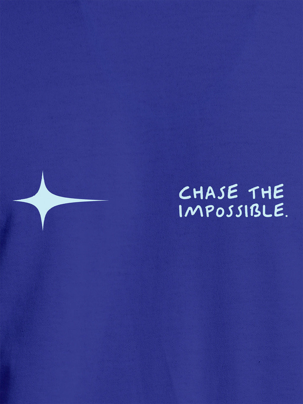 Close up of 'Chase The Impossible' design on Women's Blue Round Neck T-shirt, highlighting intricate details and vibrant print.