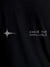 Close up of 'Chase The Impossible' design on Men's Black Round Neck T-shirt, highlighting intricate details and vibrant print.