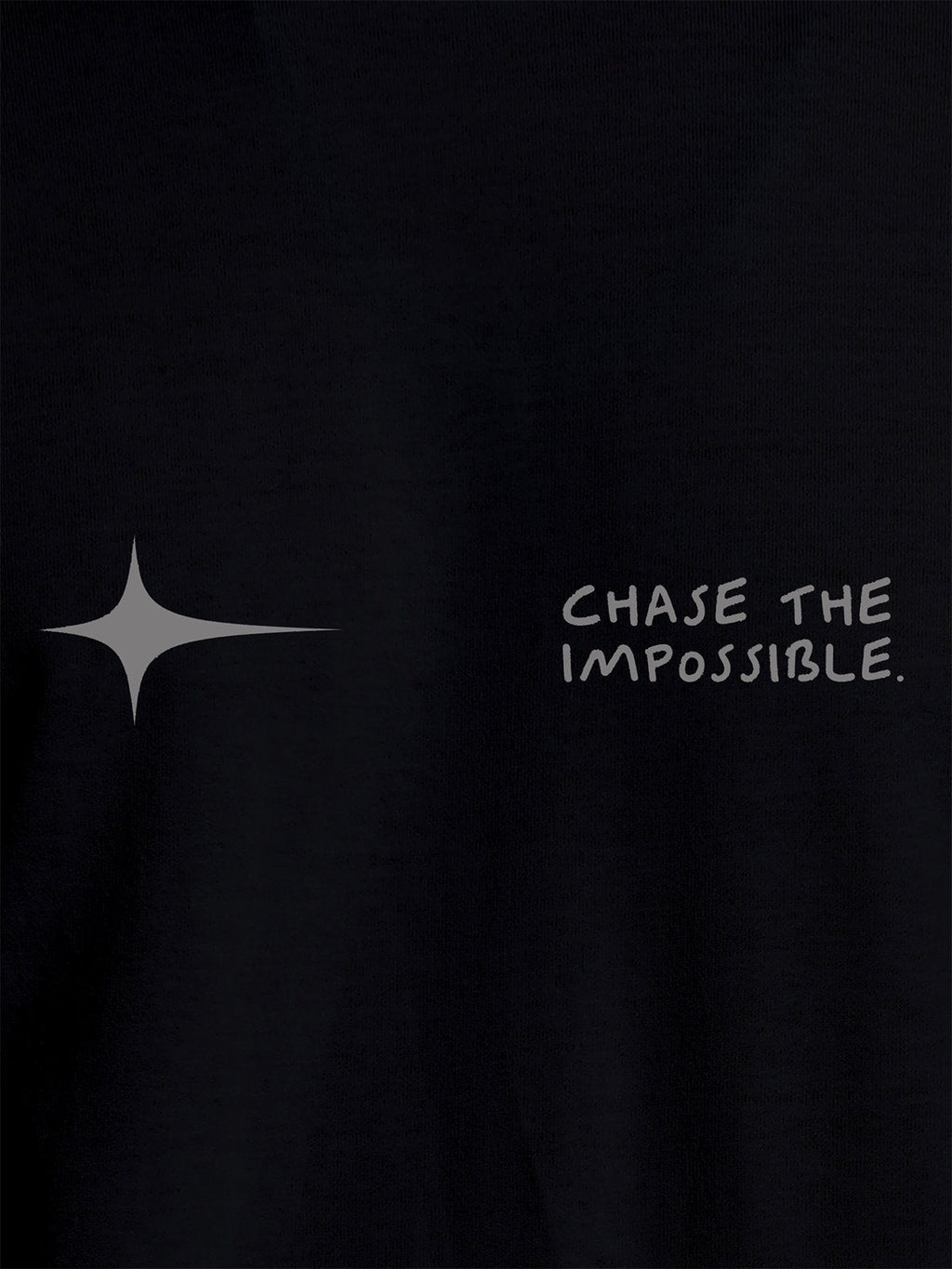 Close up of 'Chase The Impossible' design on Women's Black Round Neck T-shirt, highlighting intricate details and vibrant print.