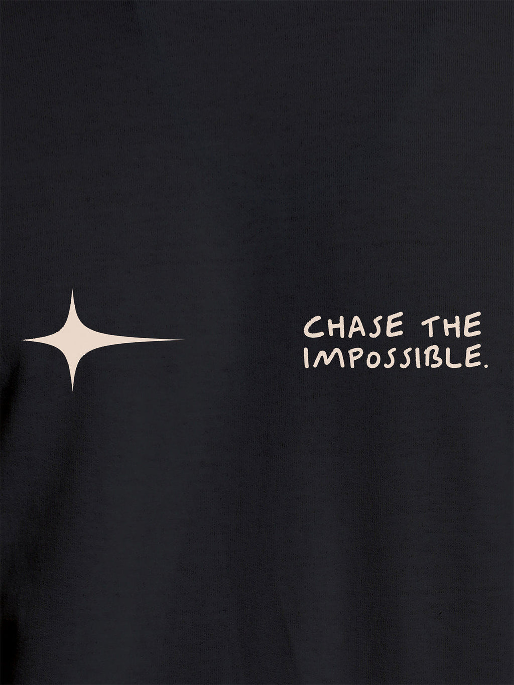 Close up of 'Chase The Impossible' design on Women's Dark Grey Round Neck T-shirt, highlighting intricate details and vibrant print.