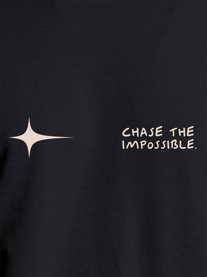 Close up of 'Chase The Impossible' design on Women's Dark Grey Round Neck T-shirt, highlighting intricate details and vibrant print.
