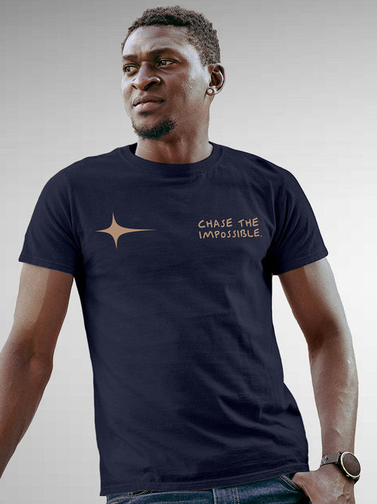 Model wearing Men's Navy Blue Round Neck T-shirt with 'Chase The Impossible' design, offering effortless style and premium comfort