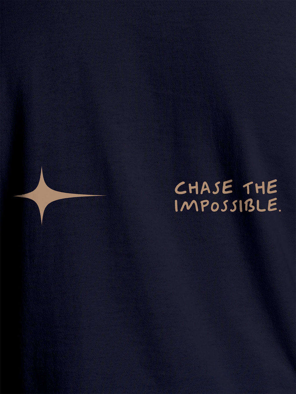 Close up of 'Chase The Impossible' design on Men's Navy Blue Round Neck T-shirt, highlighting intricate details and vibrant print.