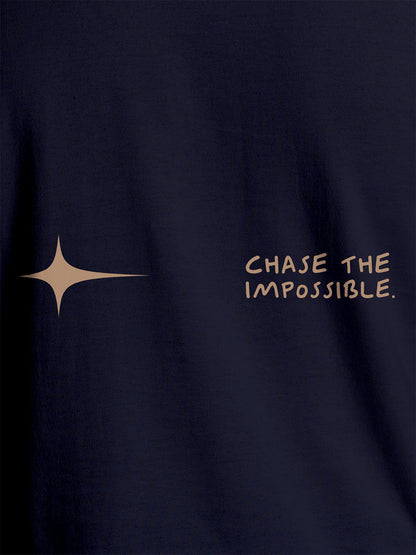 Close up of 'Chase The Impossible' design on Men's Navy Blue Round Neck T-shirt, highlighting intricate details and vibrant print.