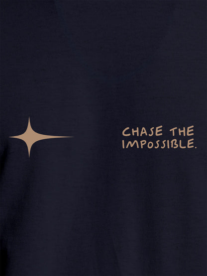 Close up of 'Chase The Impossible' design on Women's Navy Blue Round Neck T-shirt, highlighting intricate details and vibrant print.