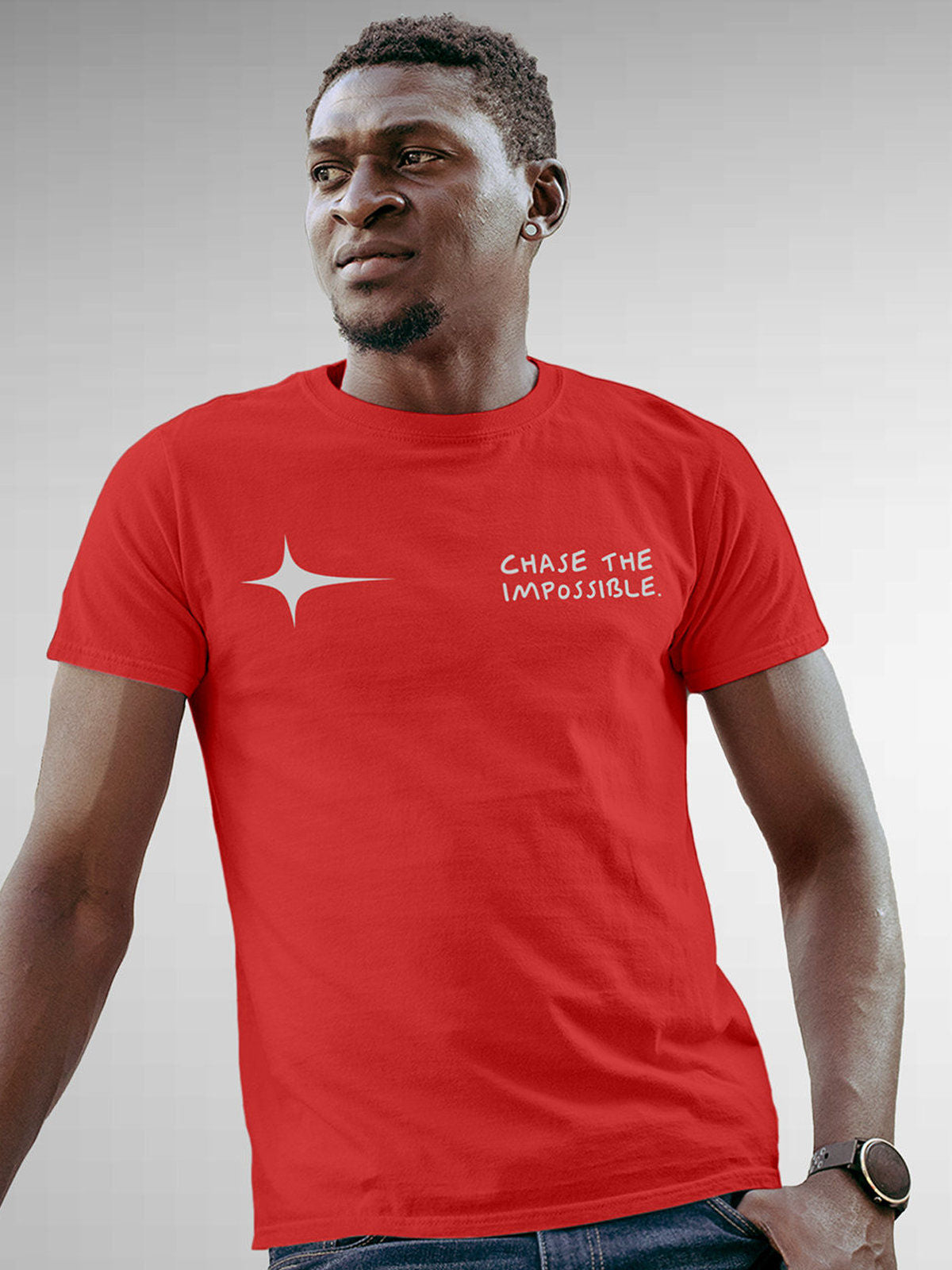 Model wearing Men's Red Round Neck T-shirt with 'Chase The Impossible' design, offering effortless style and premium comfort