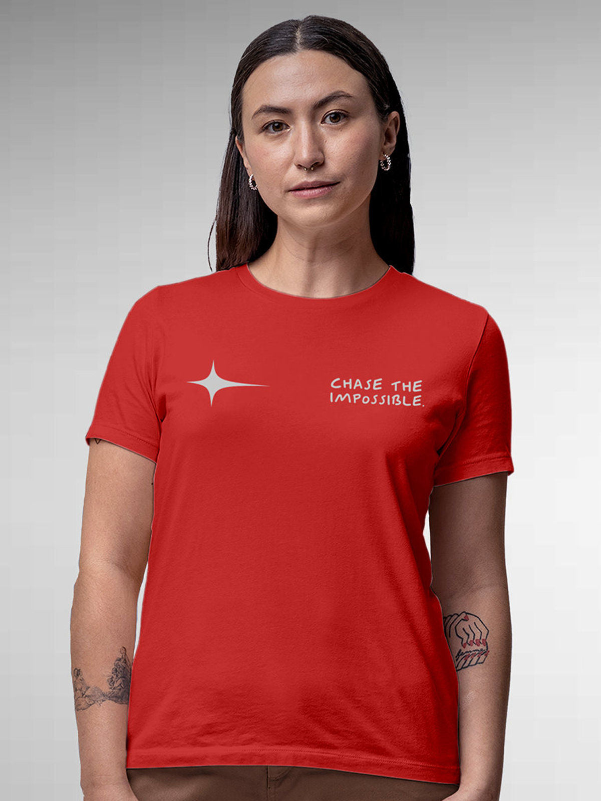 Model wearing Women's Red Round Neck T-shirt with 'Chase The Impossible' design, offering effortless style and premium comfort